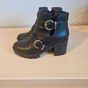 Chic Black Heeled Boots with Metallic Buckles